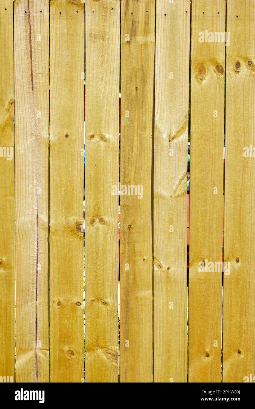 Bright natural pine wood fence panels Stock Photo