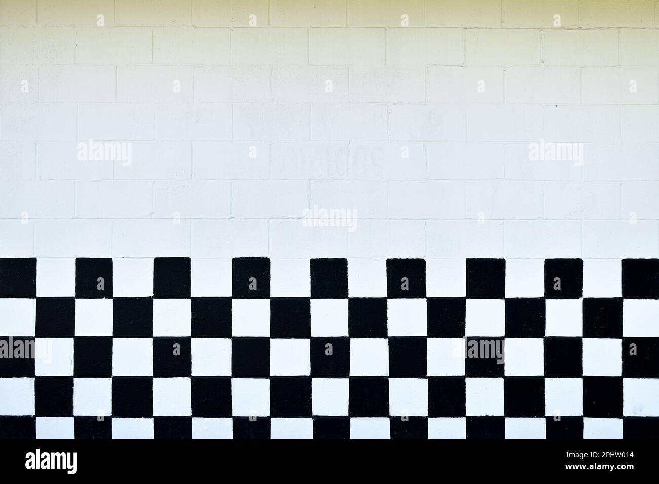 Black and white checkered cinder block wall Stock Photo