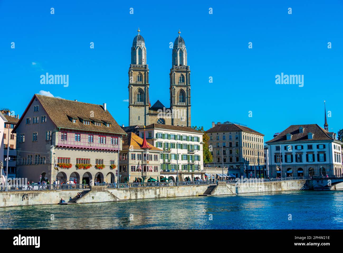 Panorama view of Limmat river with Grossmuenster cathedral in Zurich ...