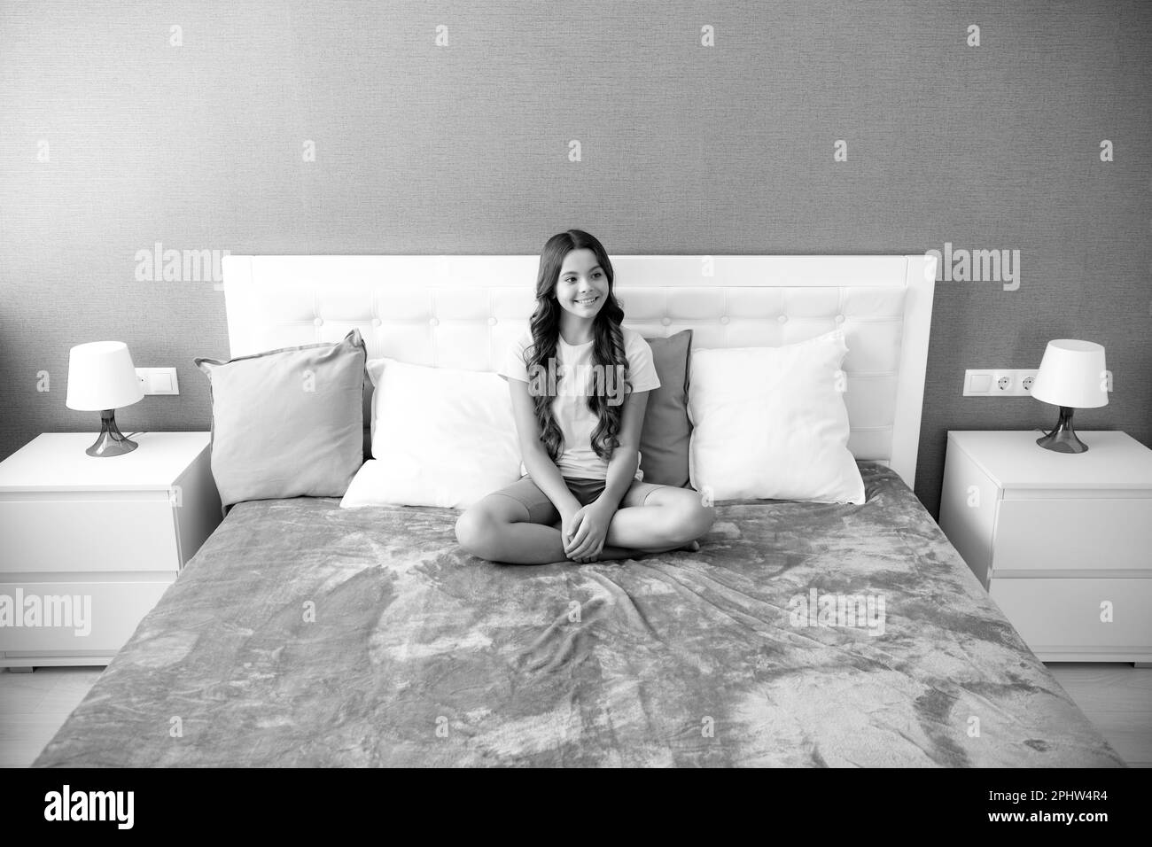 Teenager child girl resting in bed at home bedroom Stock Photo