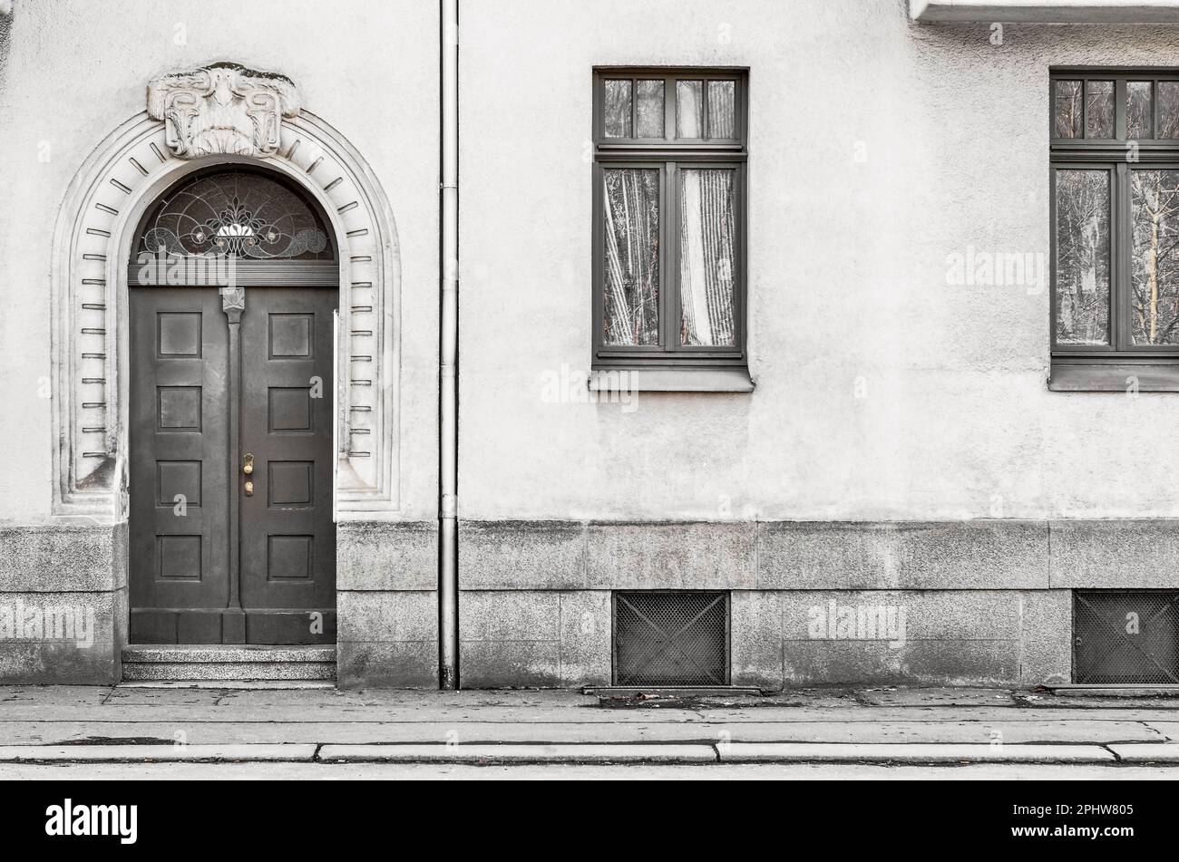 View of old building with wooden door and windows Stock Photo - Alamy