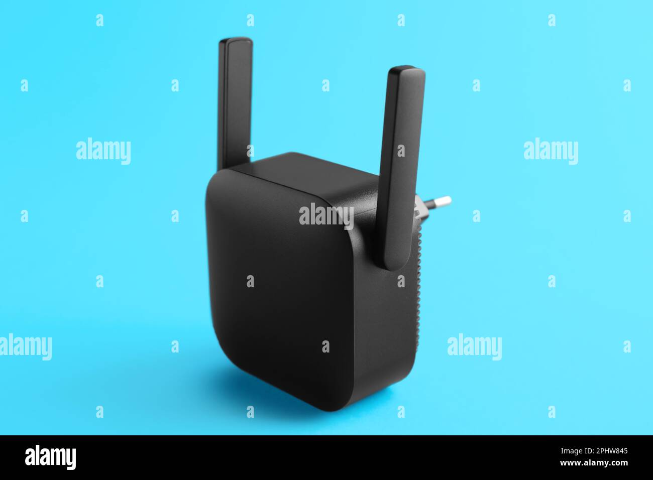 Black WiFi repeater on blue background Stock Photo