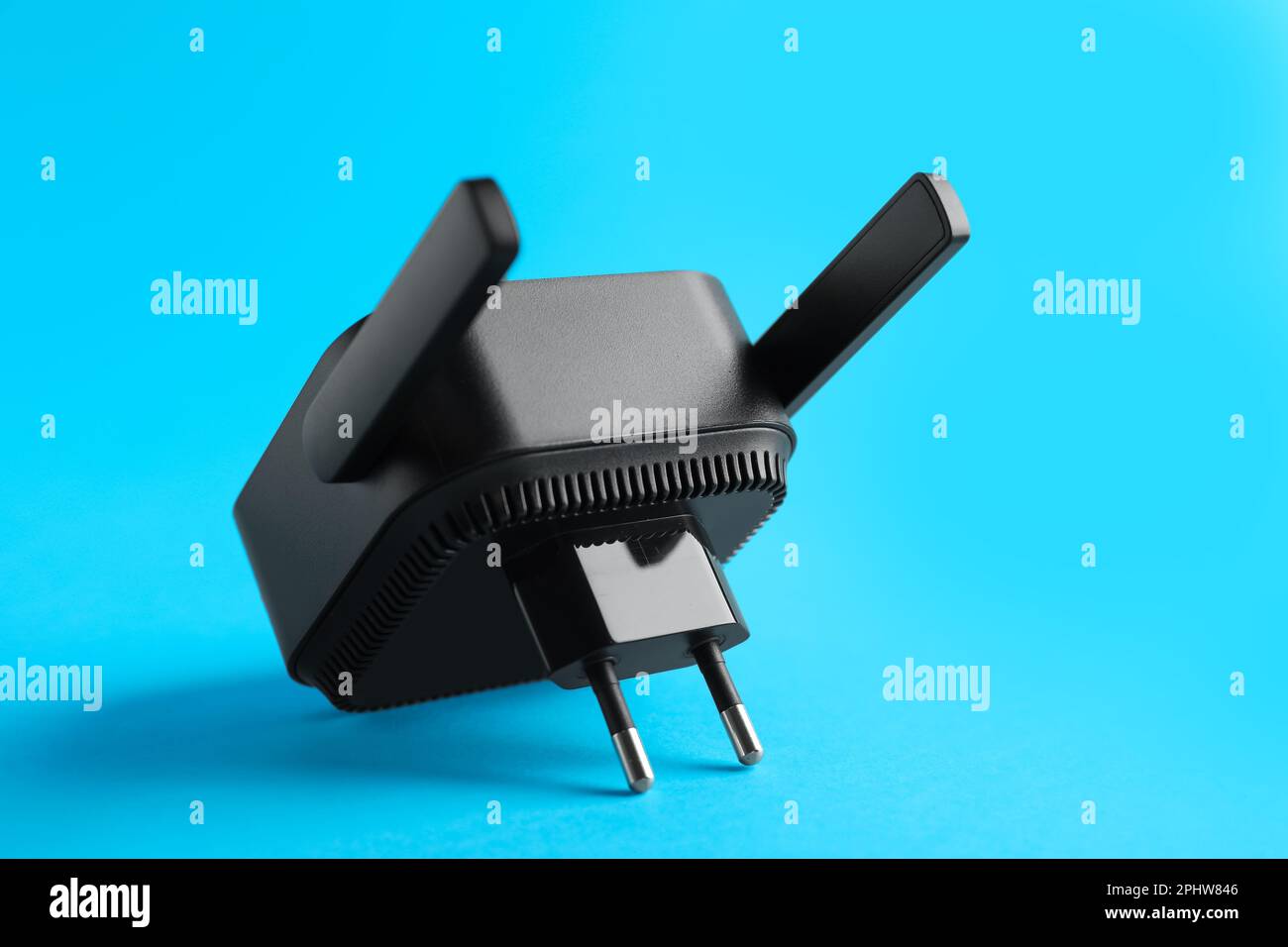 Black WiFi repeater on blue background Stock Photo
