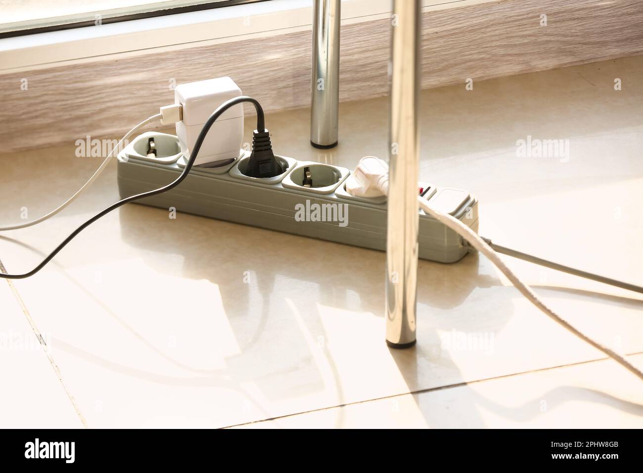 Electric extension cord with plugs on floor Stock Photo Alamy