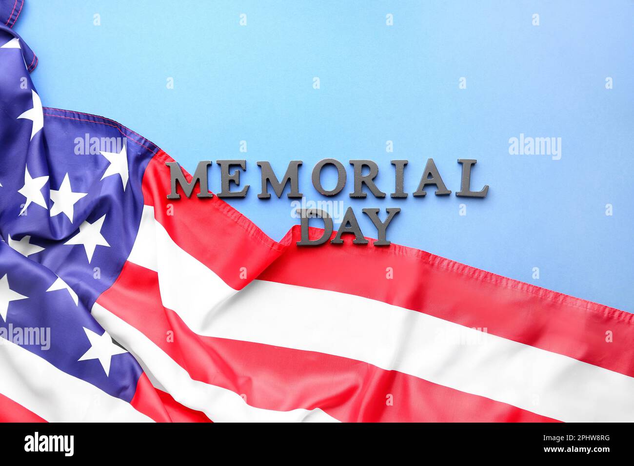 Text MEMORIAL DAY with USA flag on blue background Stock Photo - Alamy
