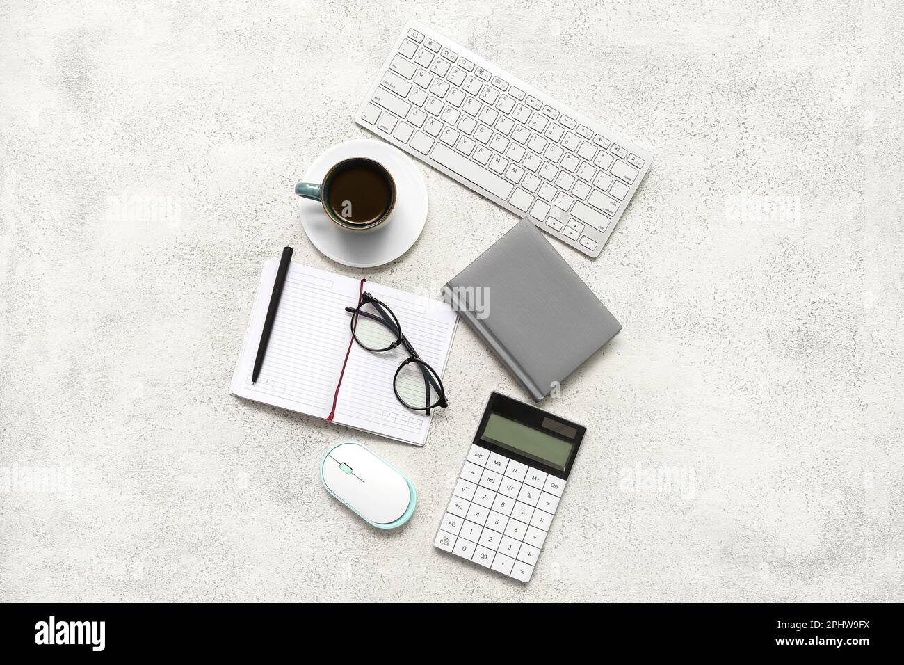 Composition with eyeglasses, blank notepad and coffee on light grunge background Stock Photo