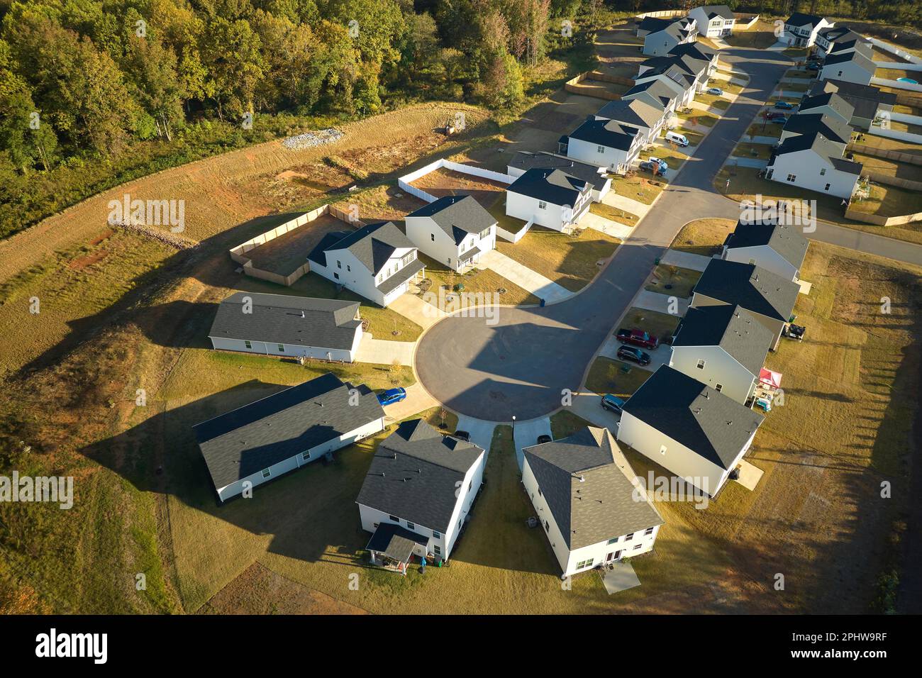 Cul de sac at neighborhood road dead end with densely built homes in
