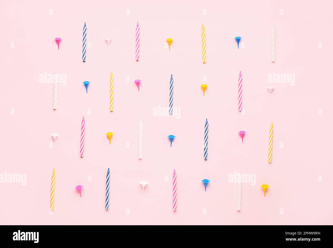 Colorful birthday candles on pink background Stock Photo - Alamy