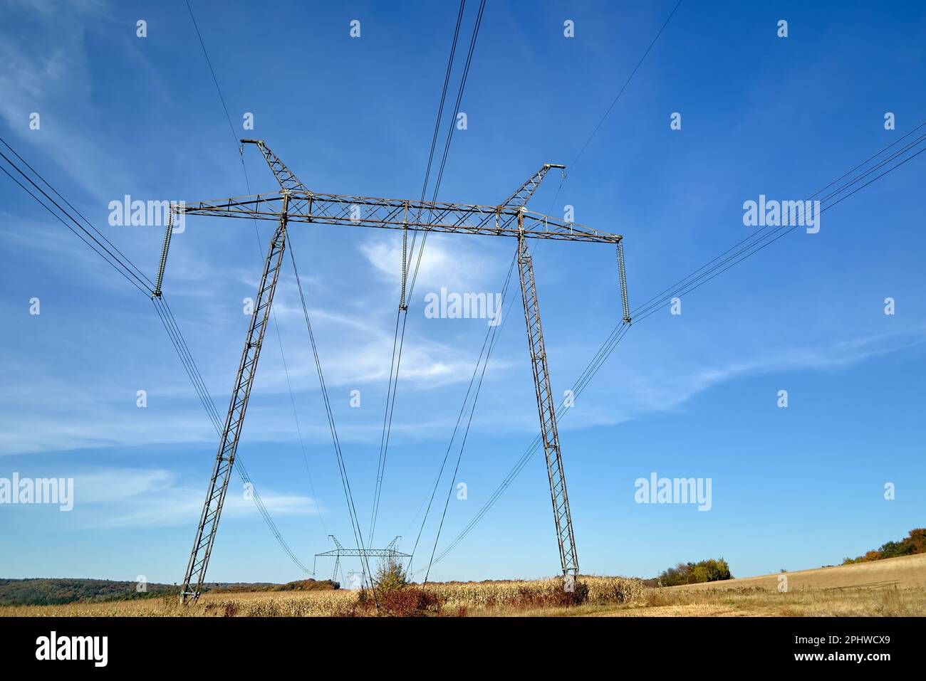 Power Through Line Steel pillar with high voltage electric power lines delivering ...