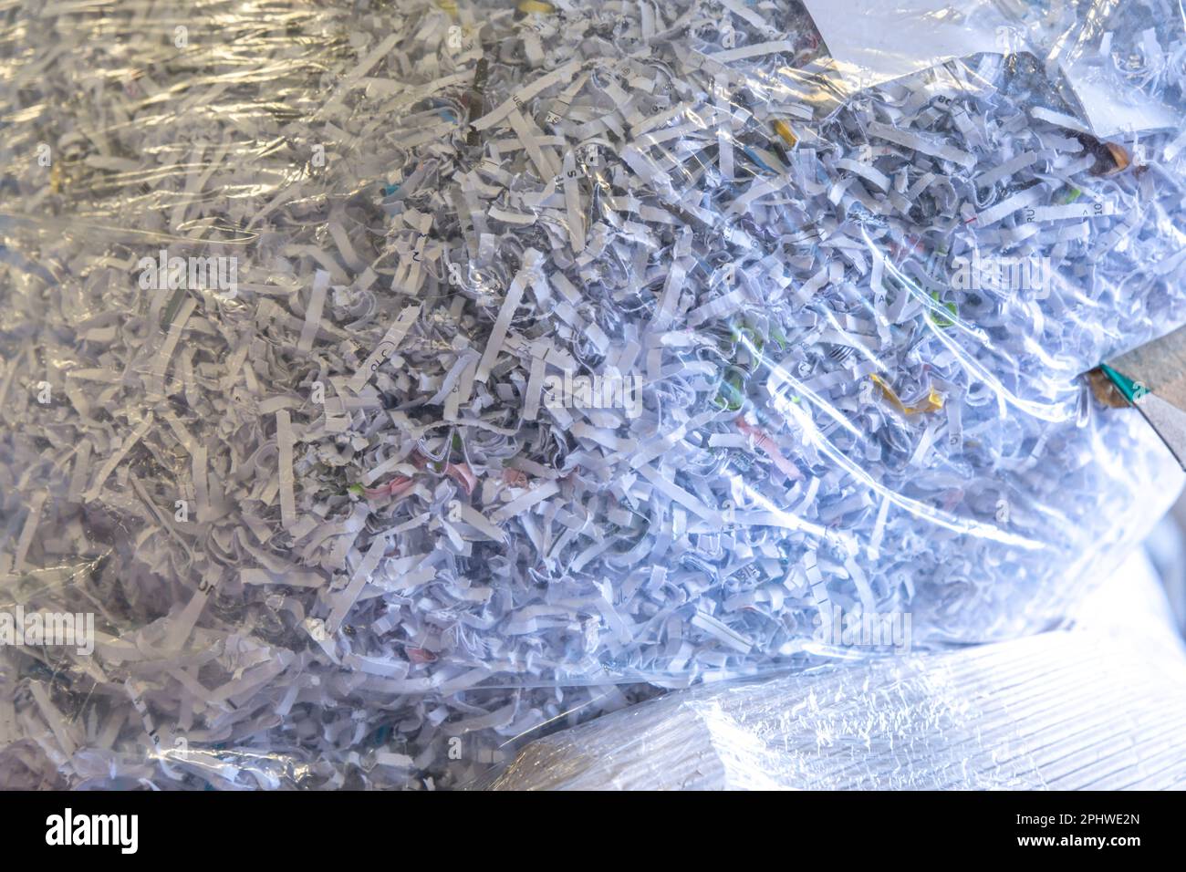 bags of shredded paper in office for recycling Stock Photo Alamy