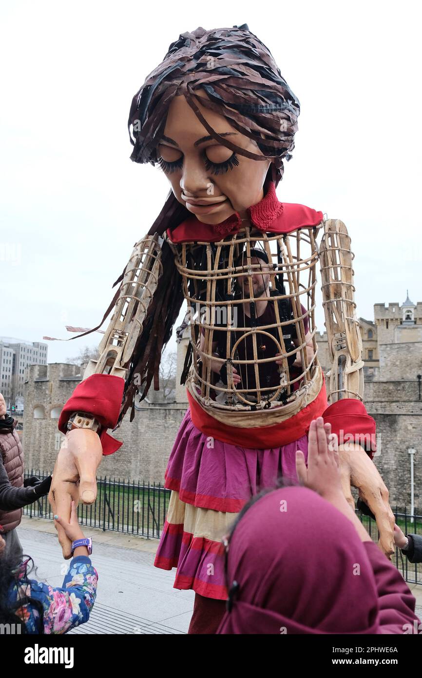 London, UK. 29th March, 2023. Little Amal, a 12-foot puppet of a Syrian refugee girl explores the Tower of London. She was created in collaboration with the Handspring Puppet Company, to raise awareness of displaced children globally, and makes a return to the Capital, after the devastation of the recent earthquakes in Syria and Turkiye. Credit: Eleventh Hour Photography/Alamy Live News Stock Photo