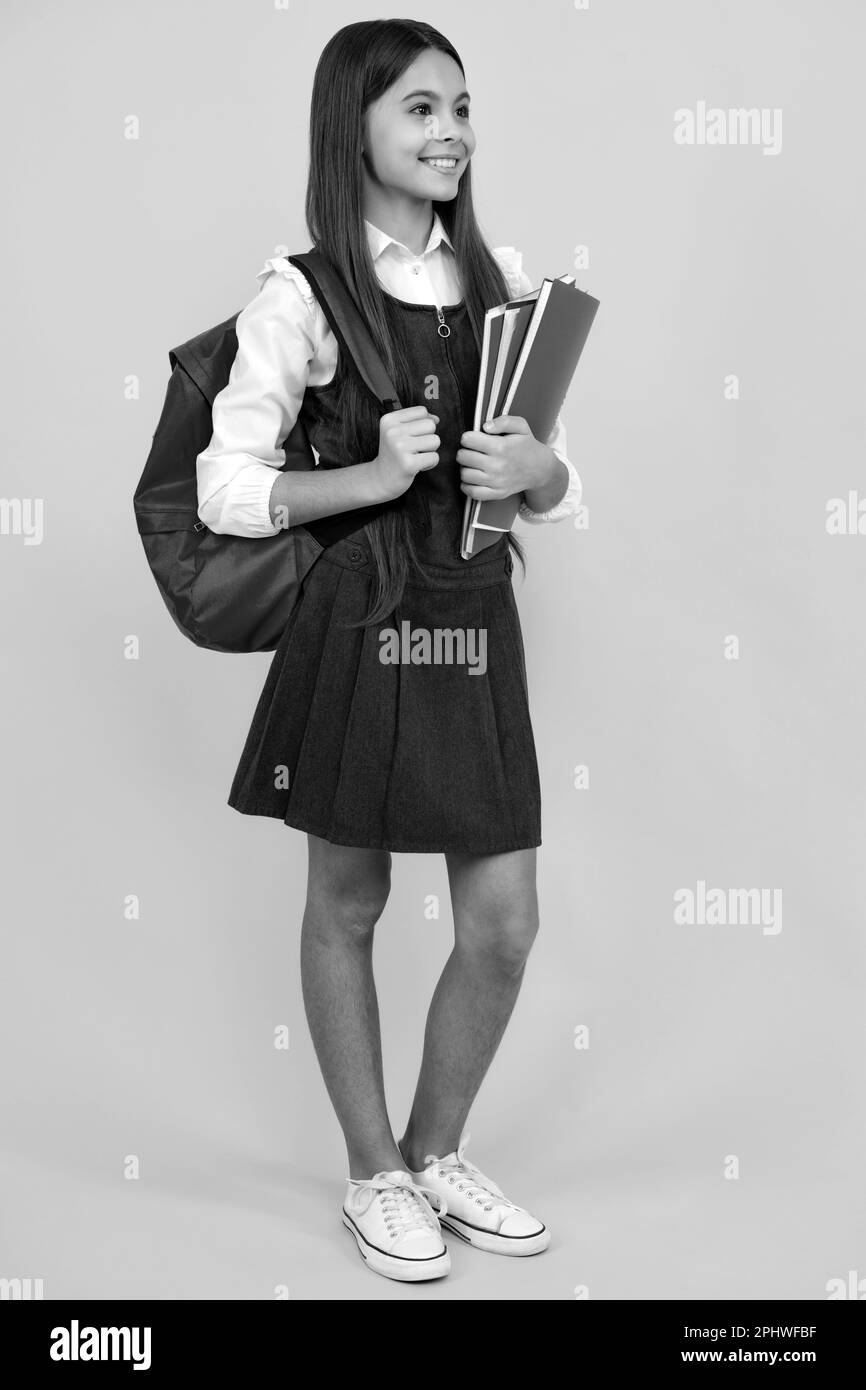 School teenager child girl 12, 13, 14 years old with school bag book