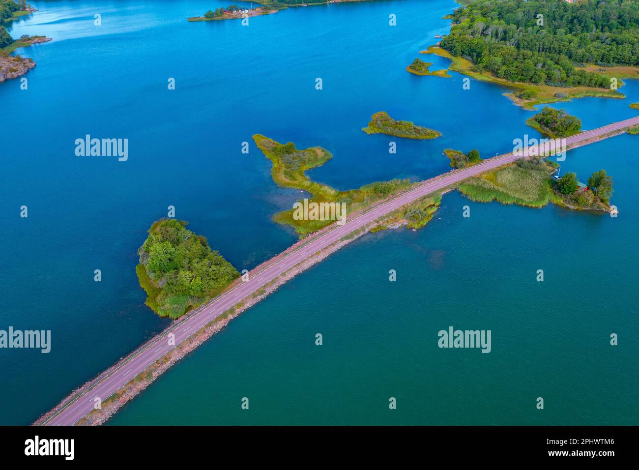 Road connecting remote islands at Aland archipelago in Finland. Stock Photo