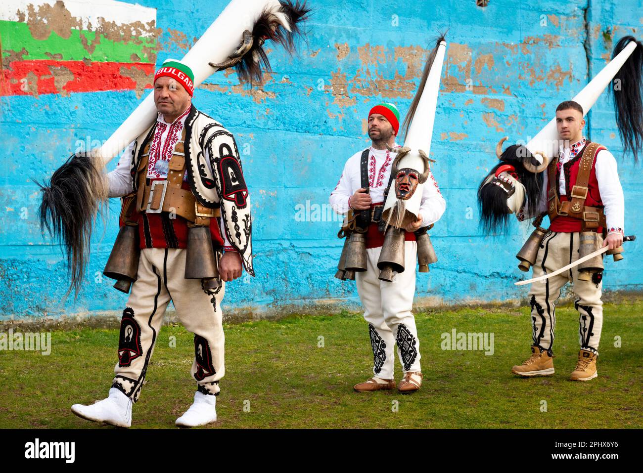 Kukeri dancers with intricate costumes and distinctive tall conical masks at the annual Simitlia winter festival in Simitli, Bulgaria, Eastern Europe Stock Photo