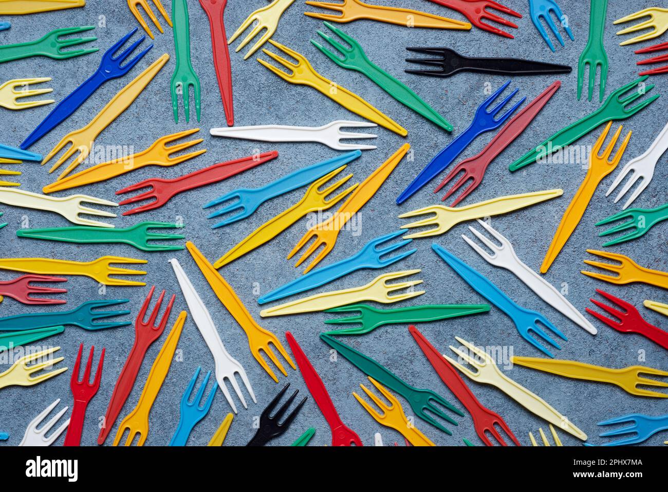 Small disposable plastic forks on a table Stock Photo Alamy