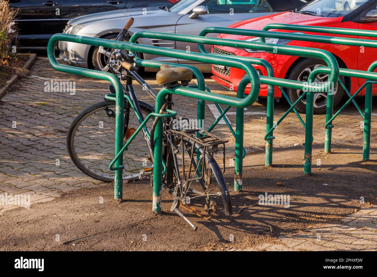 Broken bike in a parking lot Stock Photo Alamy