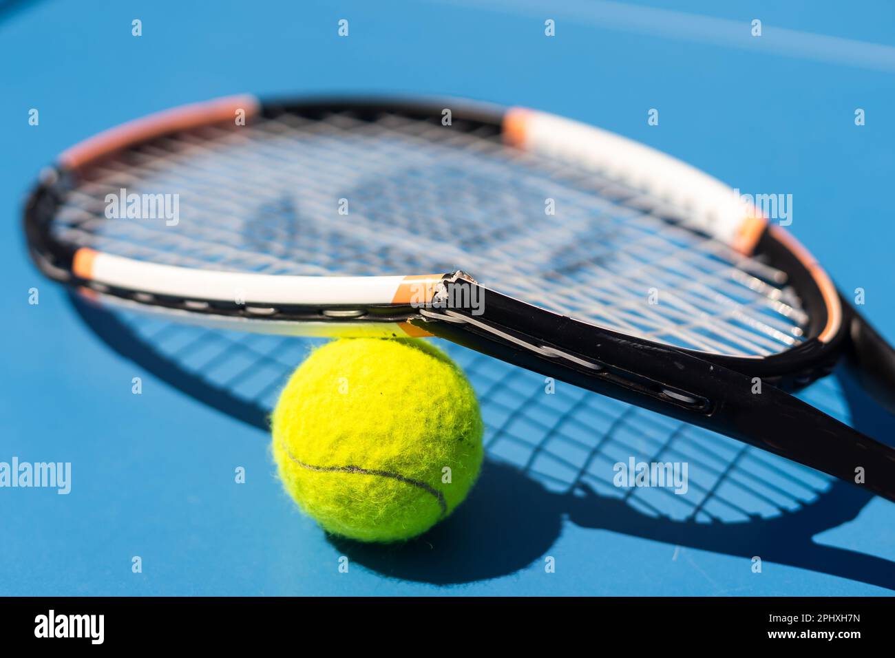 a broken tennis racket blue tennis court Stock Photo Alamy