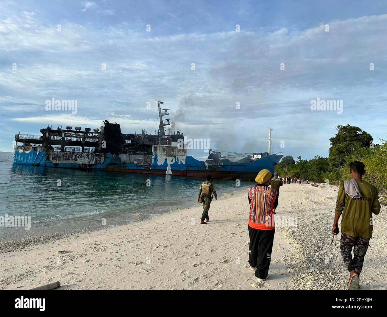 (230330) -- BASILAN PROVINCE, March 30, 2023 (Xinhua) -- The damaged M/V Lady Mary Joy 3 is seen along the coast of Basilan Province, the Philippines, March 30, 2023. A ferry carrying more than 200 people caught fire in the southern Philippines late Wednesday night, killing at least 10 passengers, the Philippine Coast Guard (PCG) said Thursday. (Pilas Island Local Government/Handout via Xinhua) Stock Photo