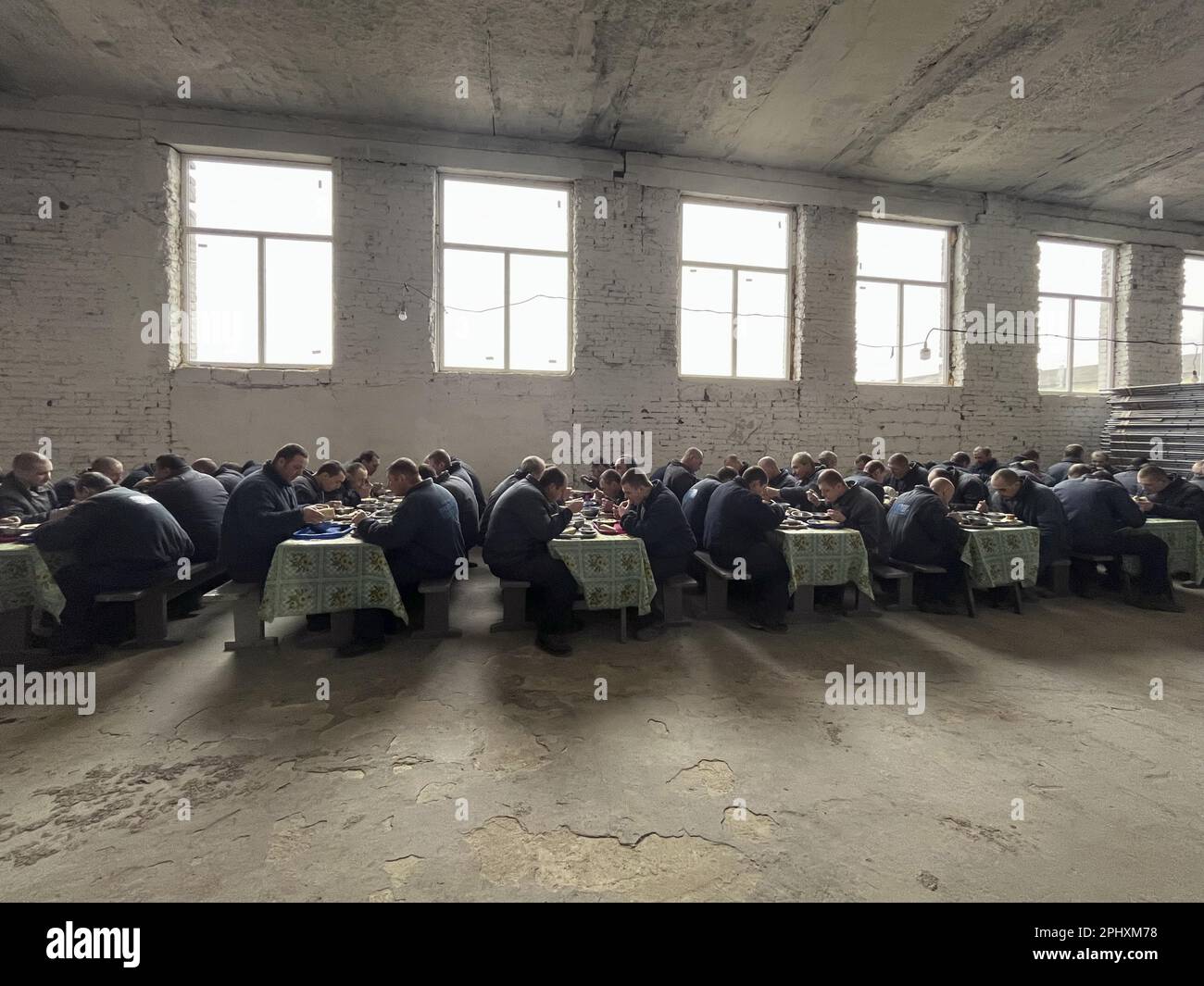 Russian prisoners of war eat lunch at an internment camp in western ...