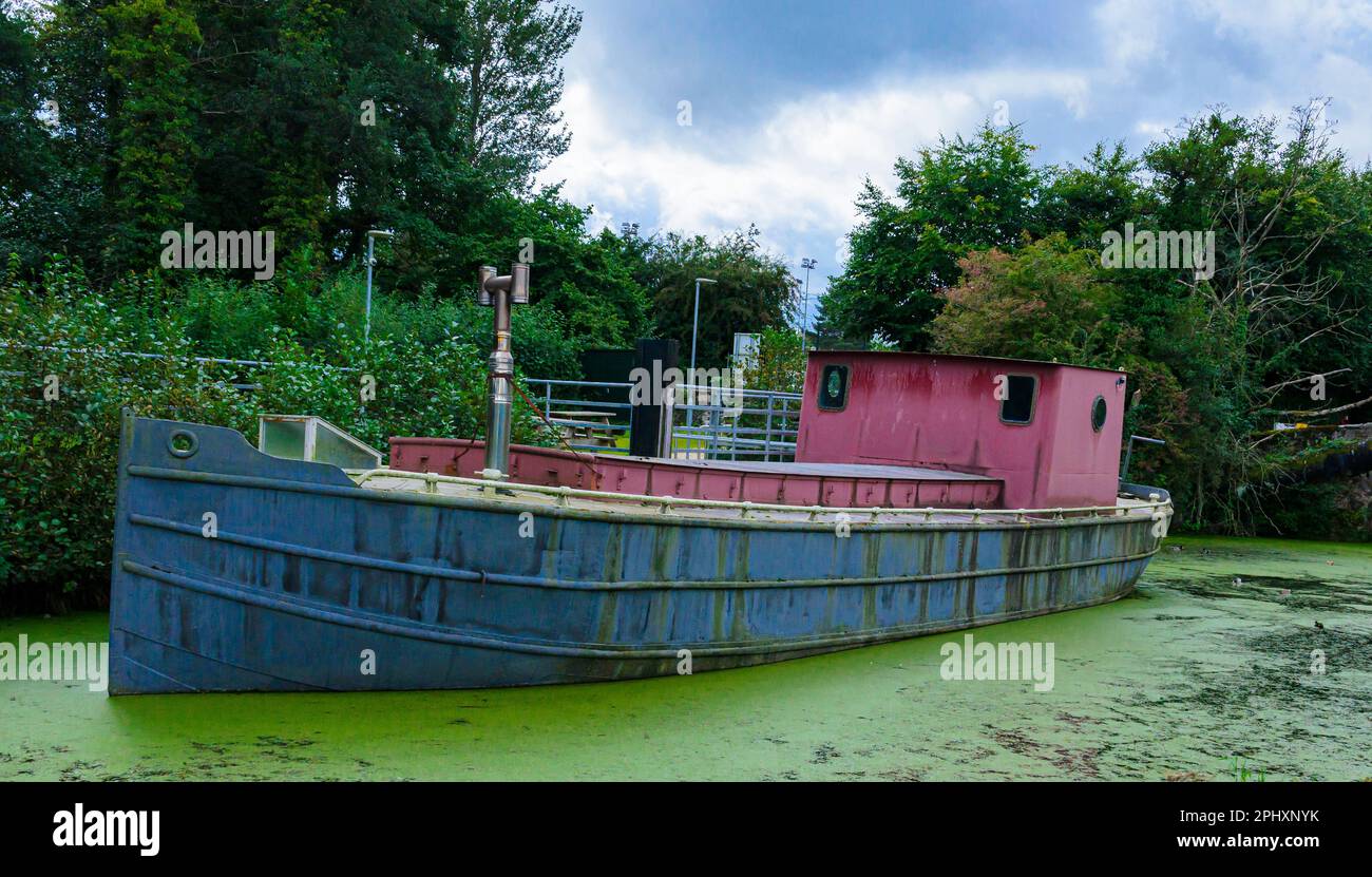 Old restored Lighter barge named Industry on the River Lagan used as a tourist attraction at McCleaves Lock near The Lock Keeper's Cottage Stock Photo