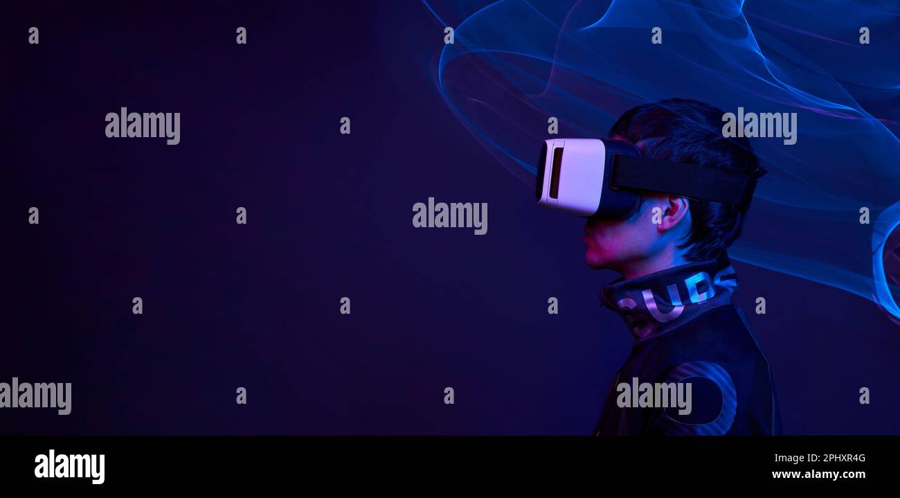 Man is using virtual reality headset to access in metaverse. Concept of ...