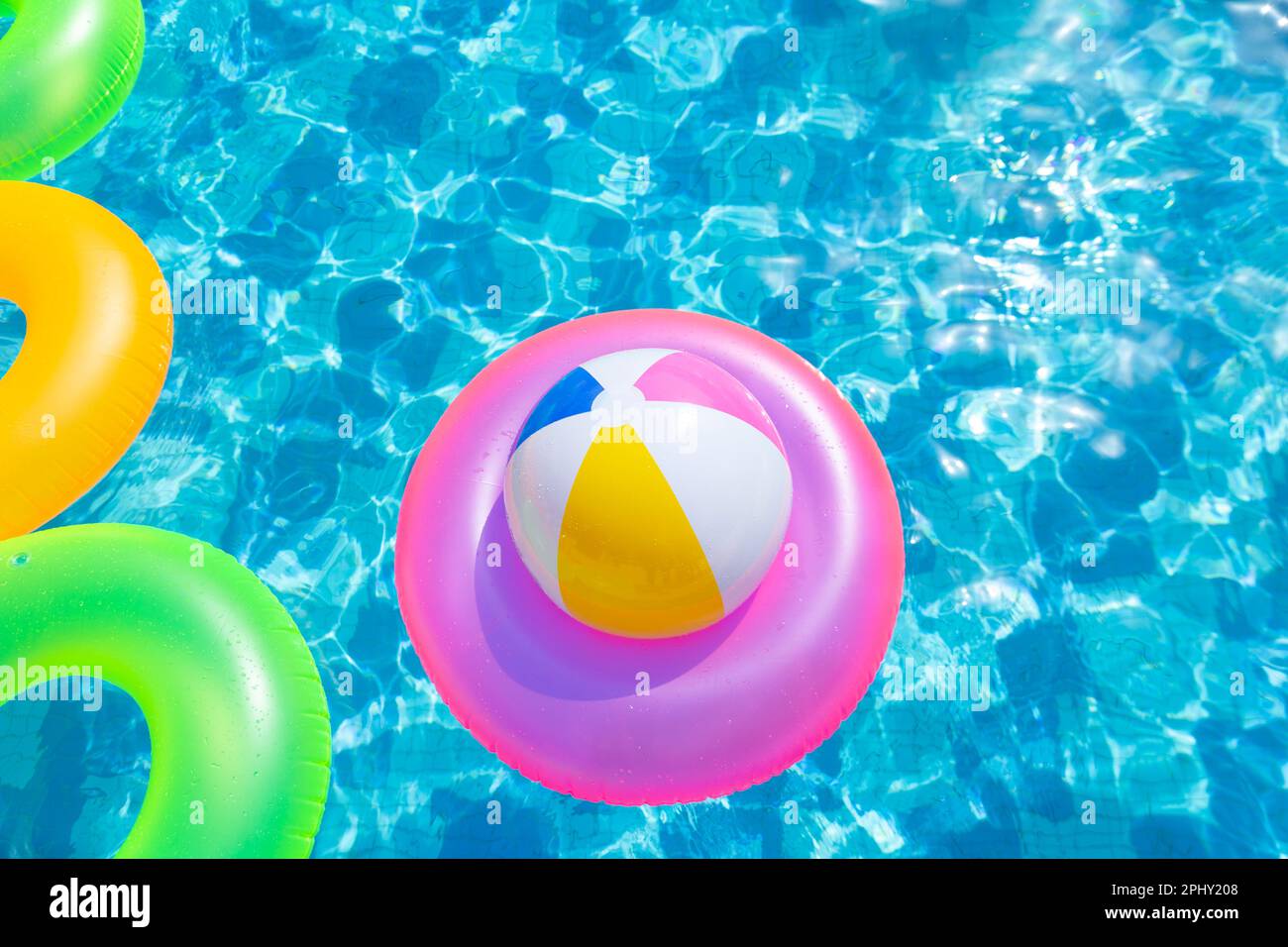 Inflatable pool ball on lifebuoy in the pool Stock Photo Alamy