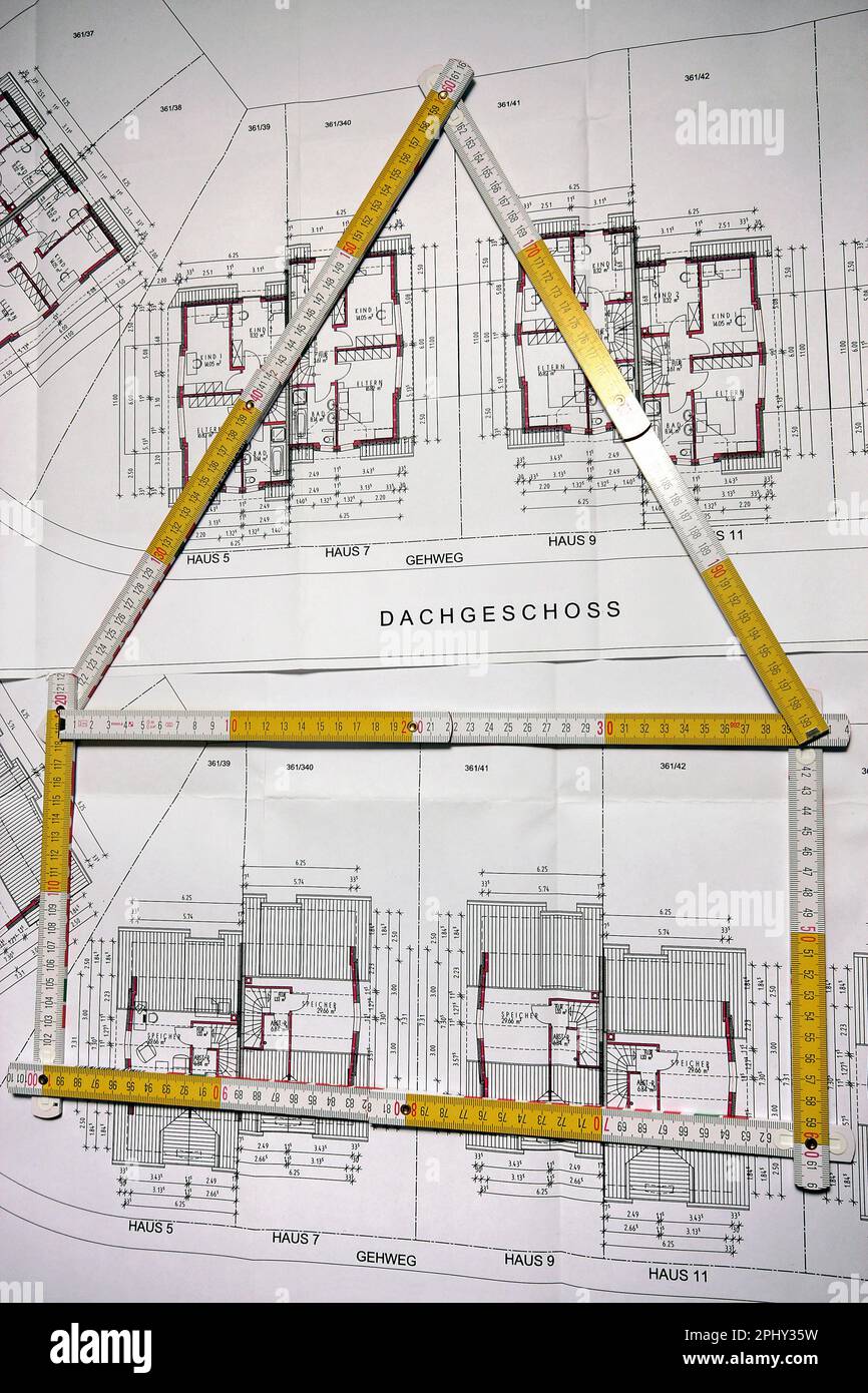 architectural drawing and folding rule in shape of a house Stock Photo