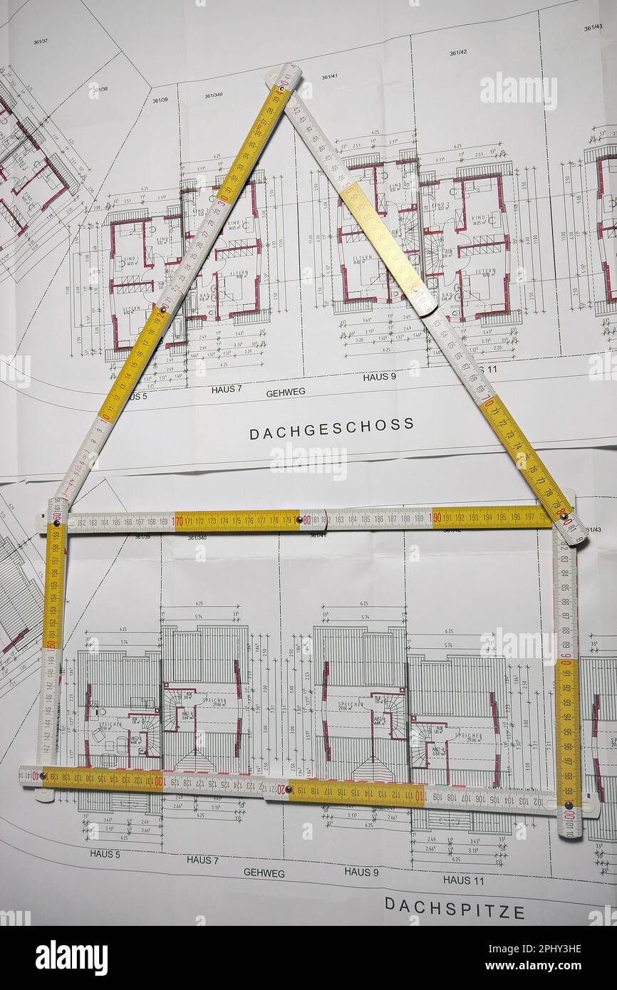 architectural drawing and folding rule in shape of a house Stock Photo