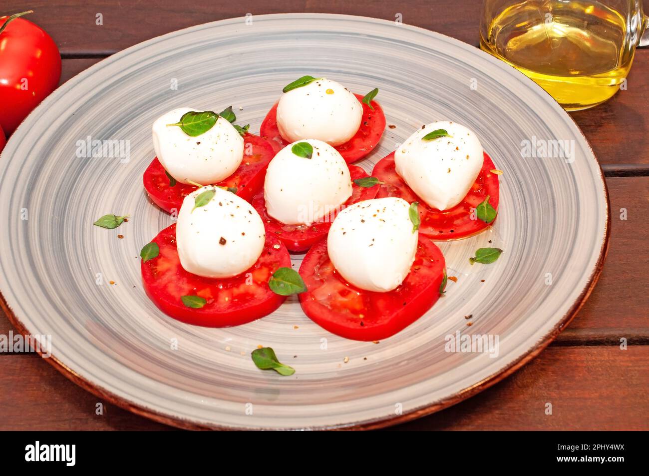 Tomato and mozzarella Caprese salad with sauce Stock Photo Alamy