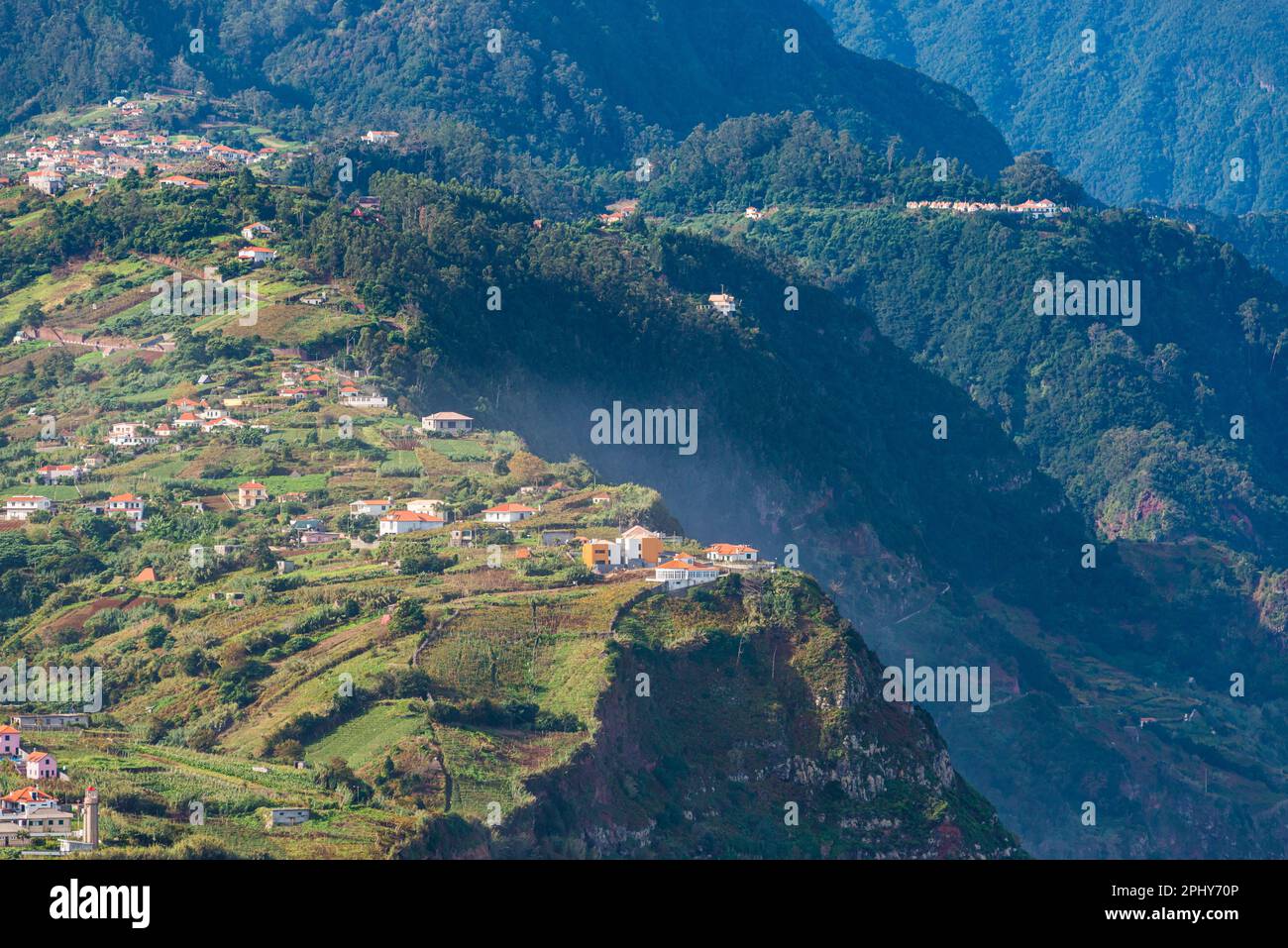 A breathtaking aerial view of the Madeira mountain range, showcasing its lush valleys and trees with tranquil plateaus. Nature at her finest! Stock Photo