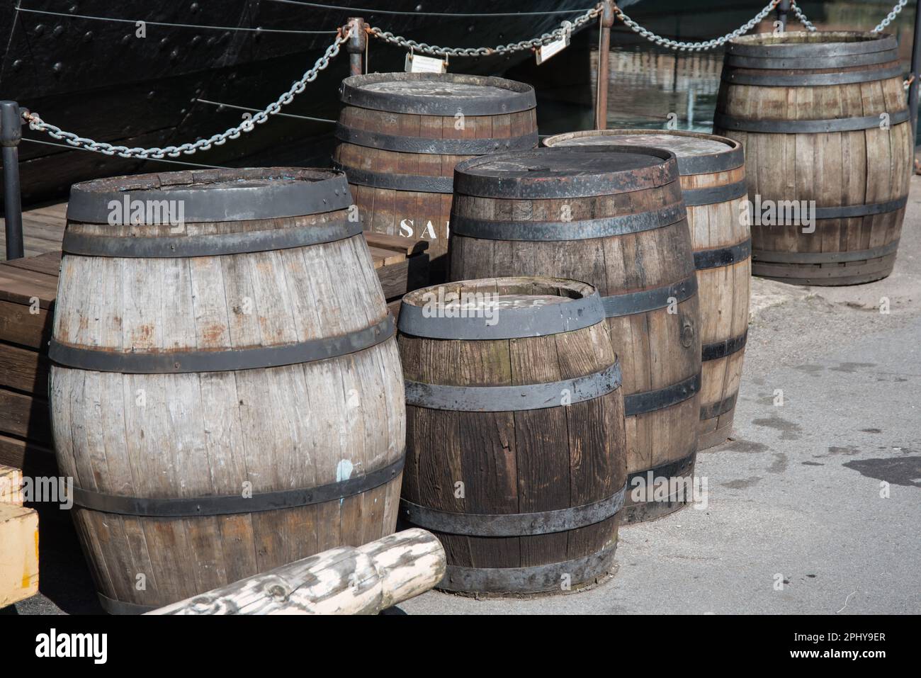 A group of variously sized old oak barrels at Bristol, England Stock Photo