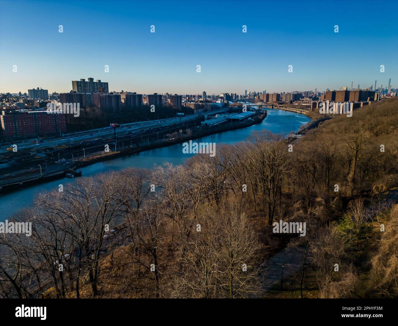 An aerial view of the Harlem River, Manhattan on the right, and the