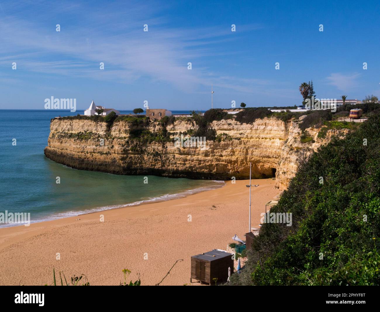 View across Nossa Senhora da Rocha Beach from coastal path to Fort and Our Lady of Rock church Alpochinos Algarve Portugal EU Stock Photo