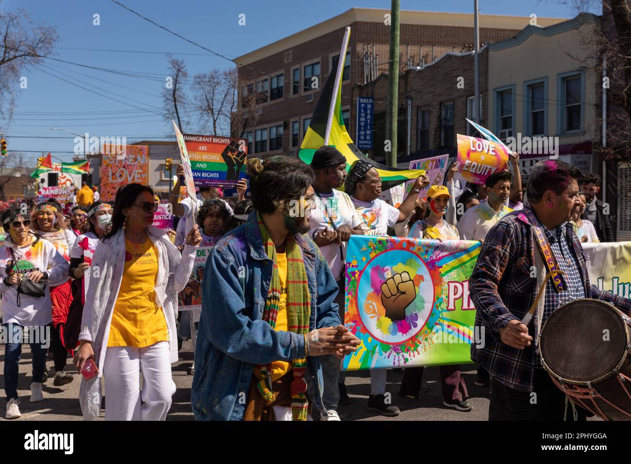 People covered in colored Powder at the Phagwah Holi Parade 2023 in