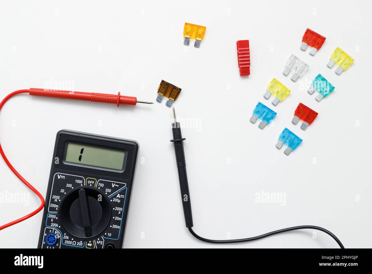 Digital multimeter for measuring electrical elements and car fuses on a