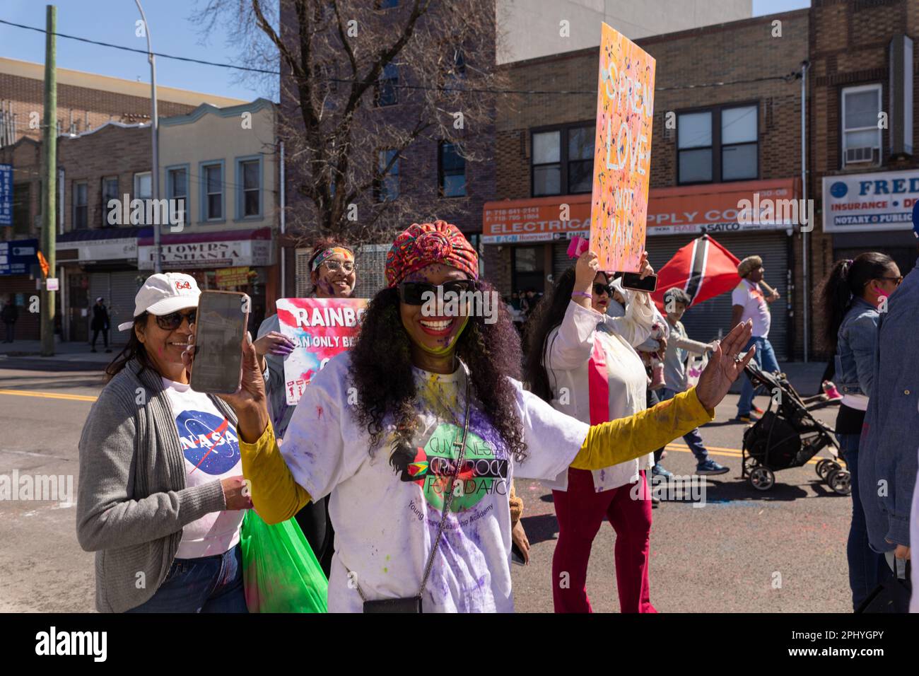 People covered in colored Powder at the Phagwah Holi Parade 2023 in