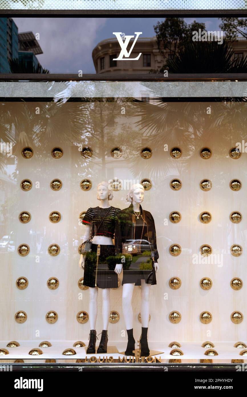 Ho Chi Minh City, Vietnam March 28, 2023 Louis Vuitton store window with 2 female mannequins