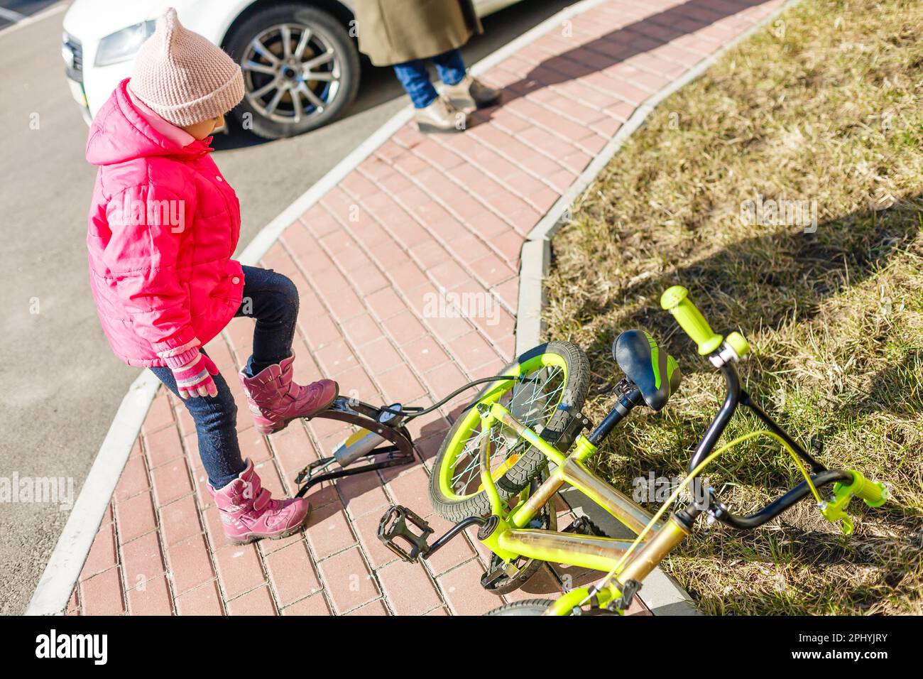 a little girl pumps up a bicycle tire Stock Photo Alamy