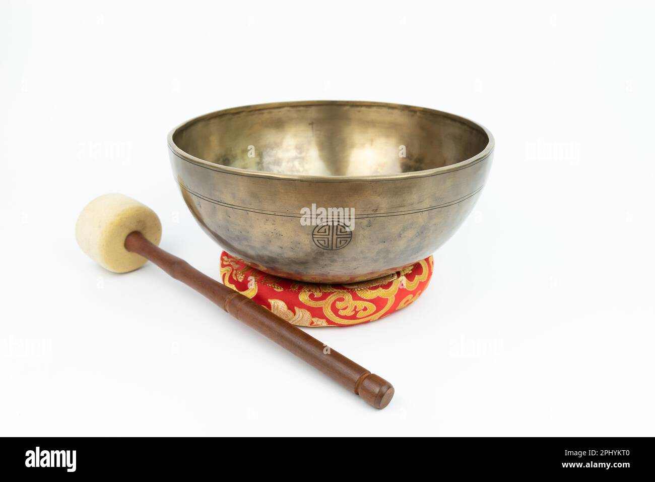 Tibetan handcrafted full moon singing bowl with white stick isolated on white background Stock Photo