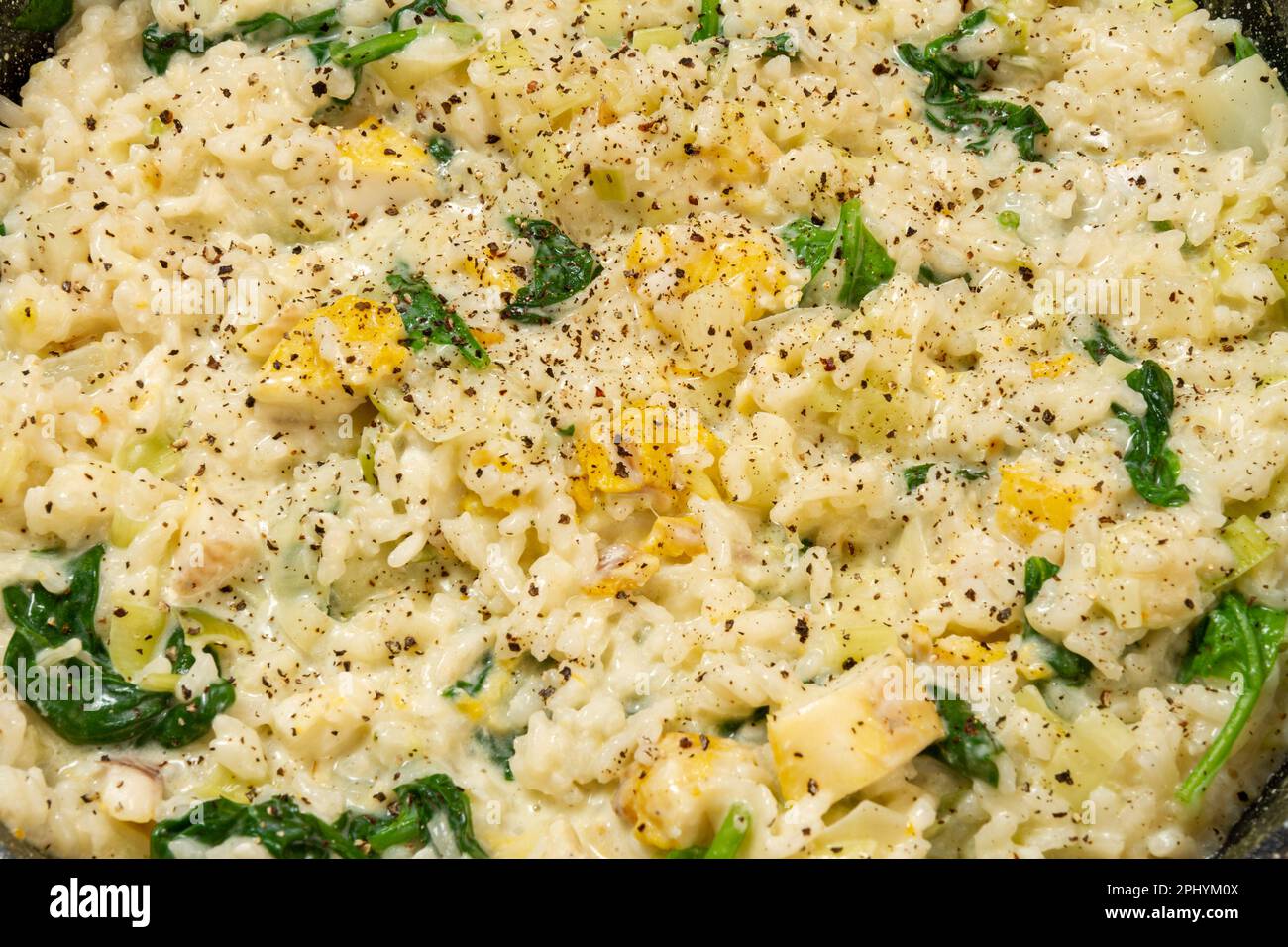 Smoked haddock and leek risotto, close up abstract Stock Photo Alamy