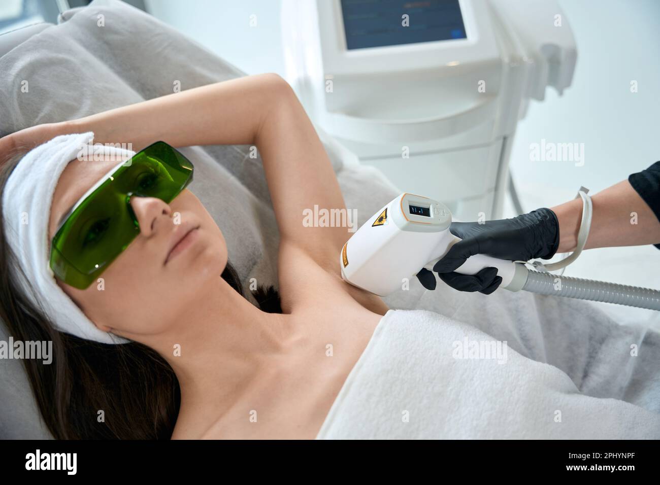 Portrait of woman on armpit laser hair removal procedure Stock Photo