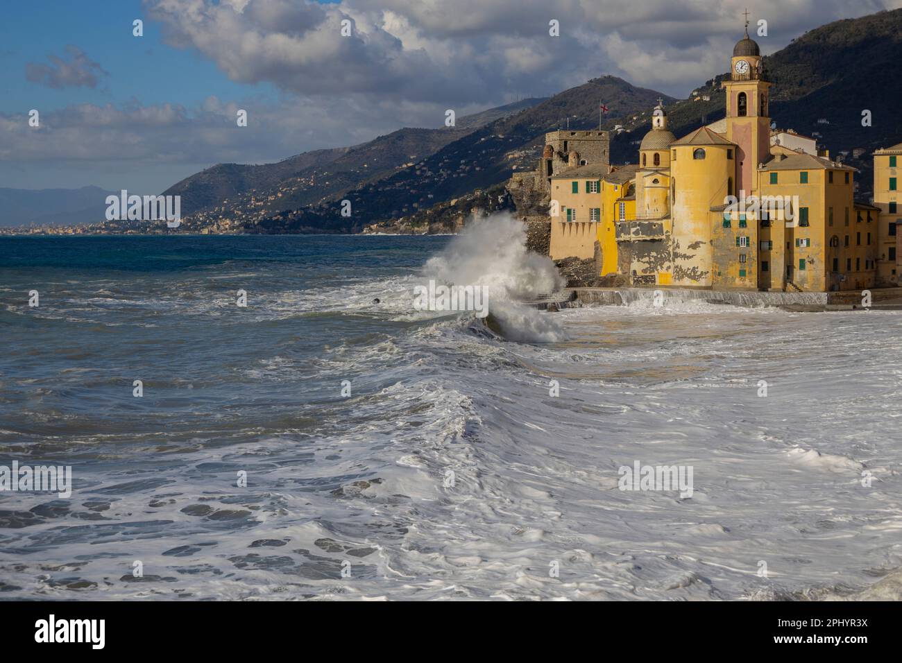 Rough sea on the beach of Camogli and the Basilica of Santa Maria Assunta,  Genoa province, Italy. Stock Photo