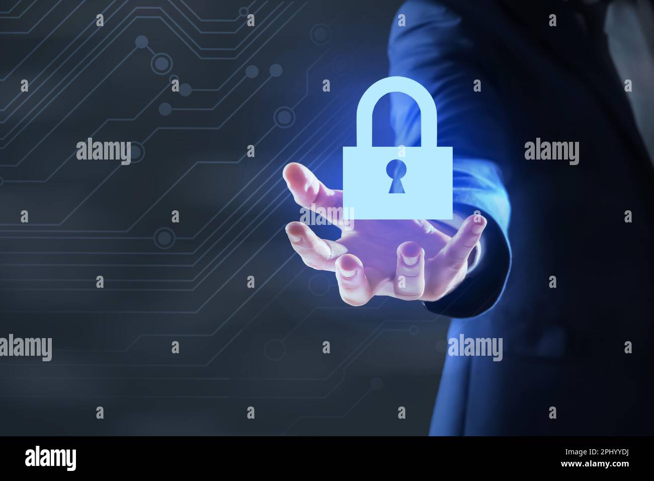 Cyber security concept. Man holding virtual icon of padlock on dark ...