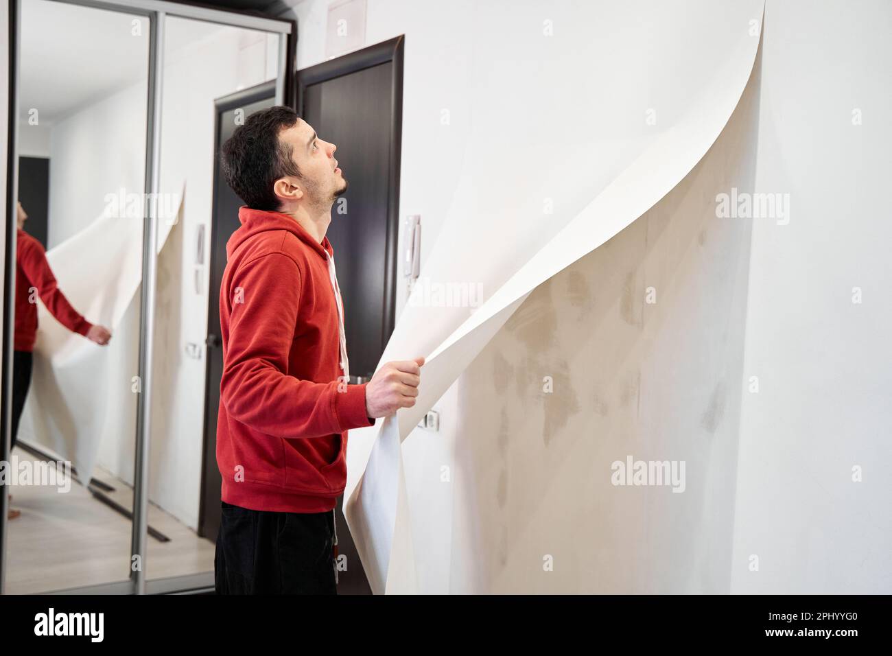 Repair the house with their own hands. The guy is ripping the old