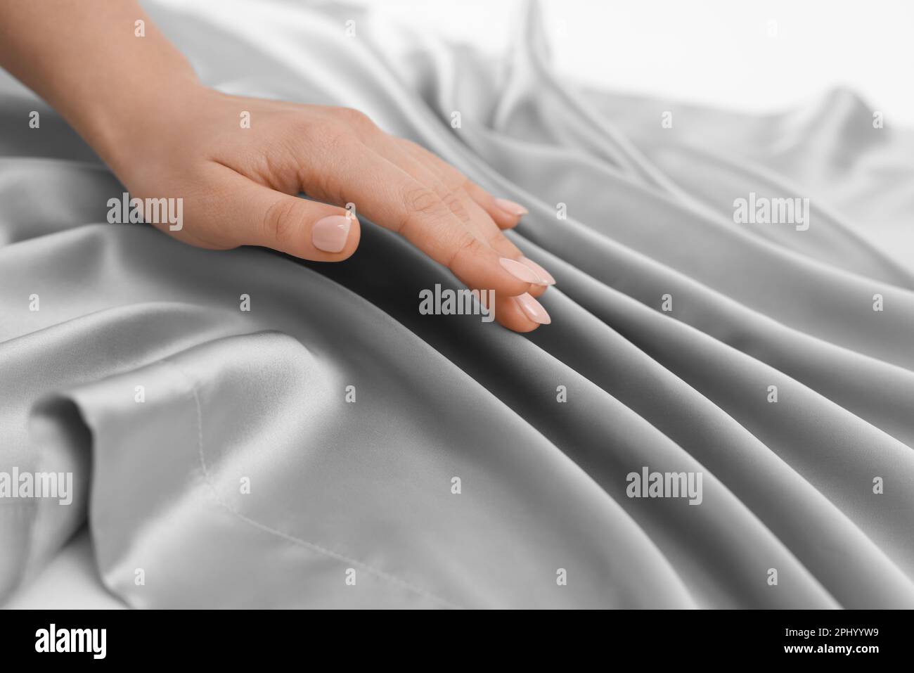 Woman touching smooth grey hi-res stock photography and images - Alamy