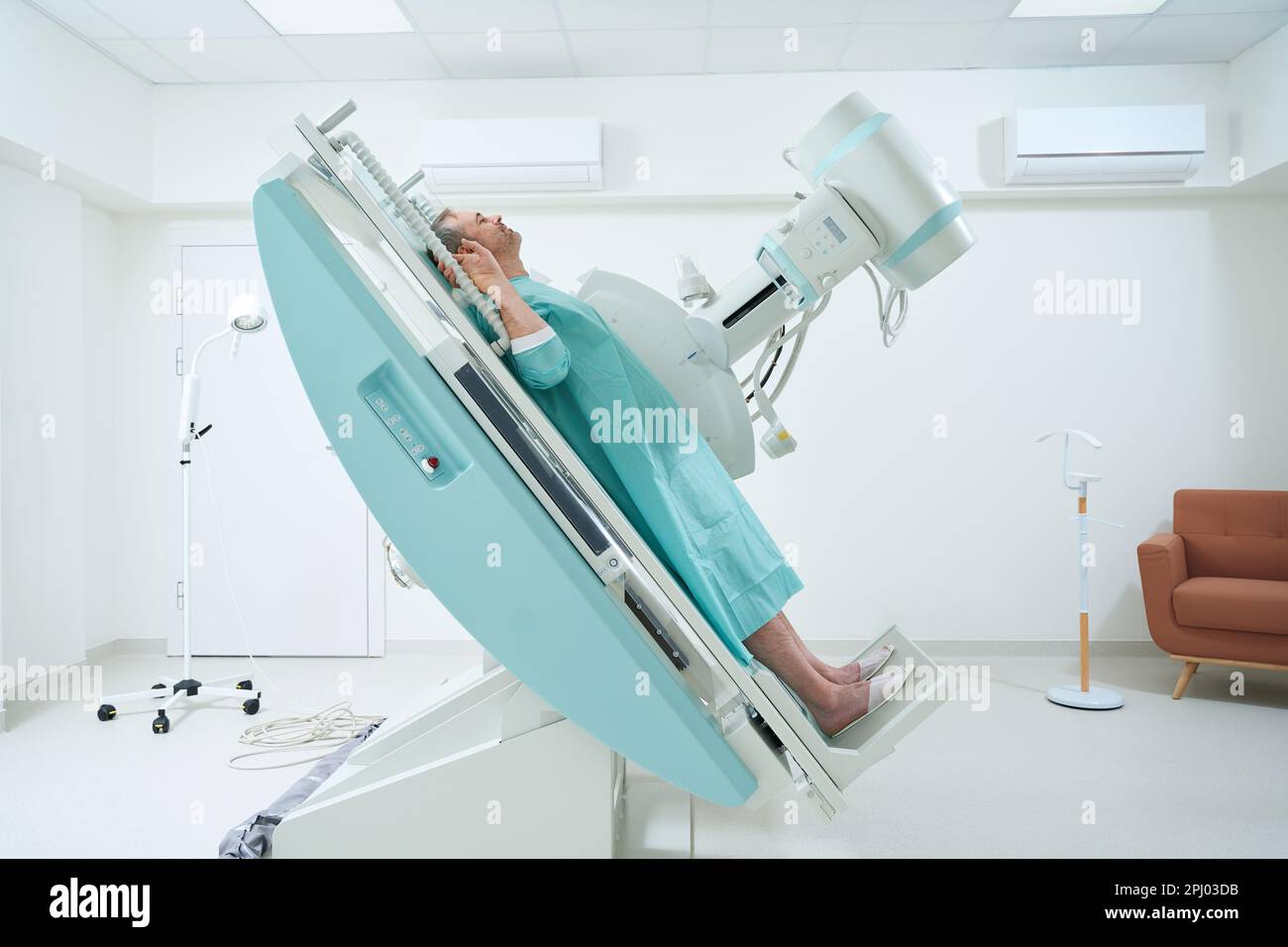 Male patient during chest X Ray procedure in clinic Stock Photo - Alamy