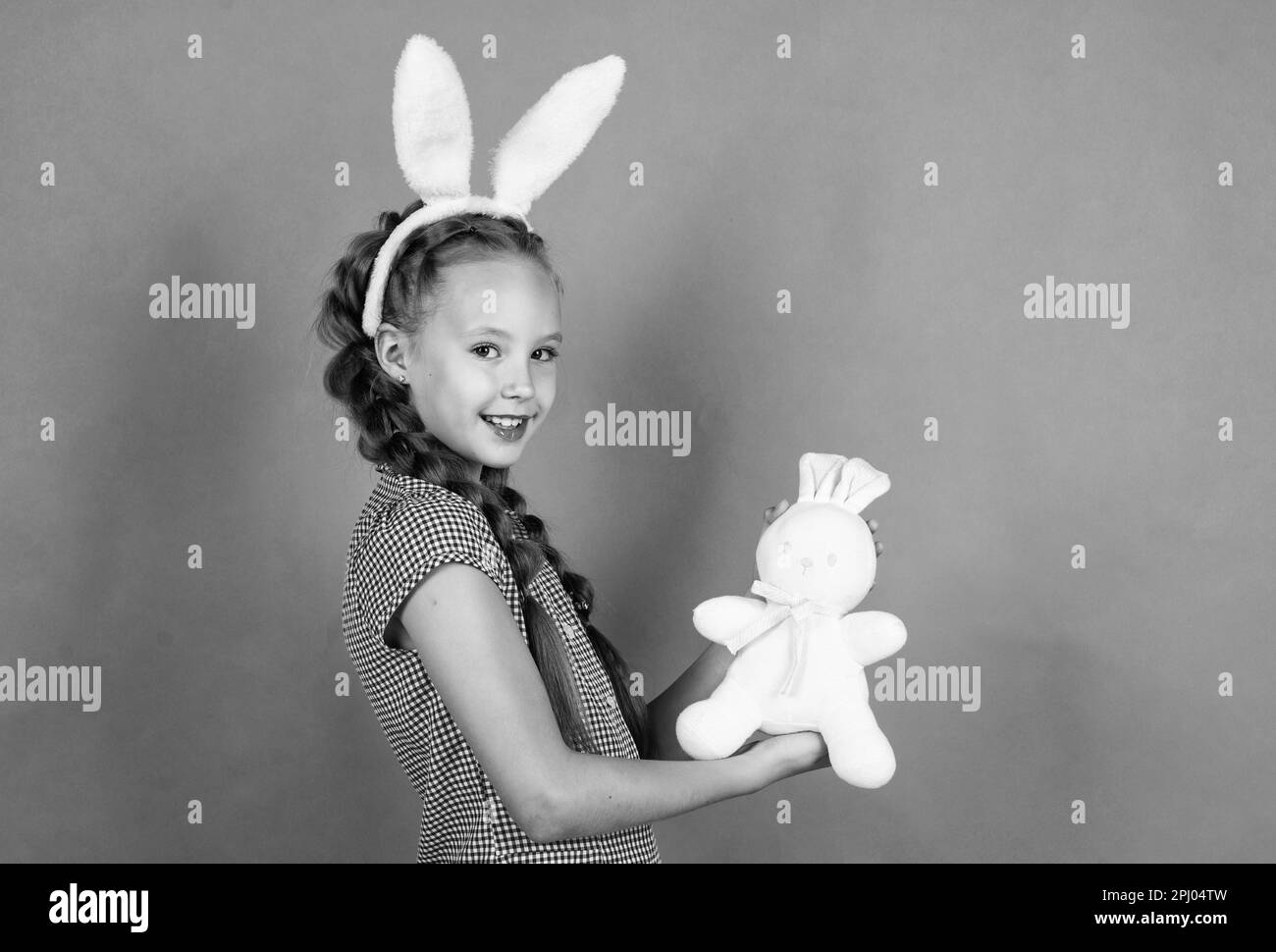 funny child in hare ears. teenager girl wear rabbit costume. easter ...