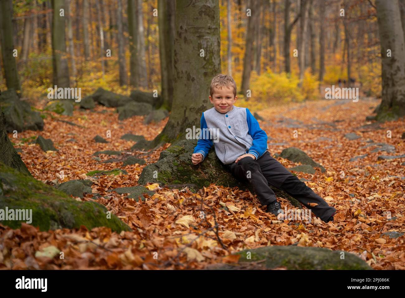 The little kid is going up the mountain trail. Fall season, Poland, Europe Stock Photo