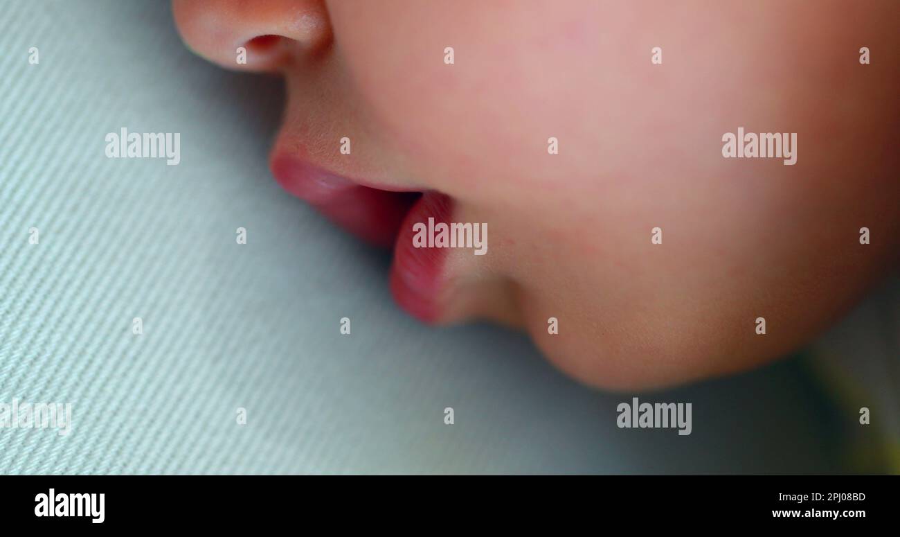 Cute baby sleeping drooling with mouth saliva Stock Photo Alamy