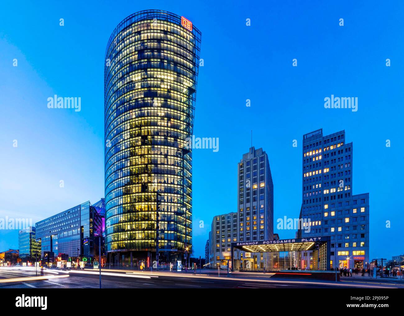 Potsdamer Platz in the evening, illuminated Bahn Tower and Hotel Ritz Carlton, traces of light, Berlin, Germany Stock Photo